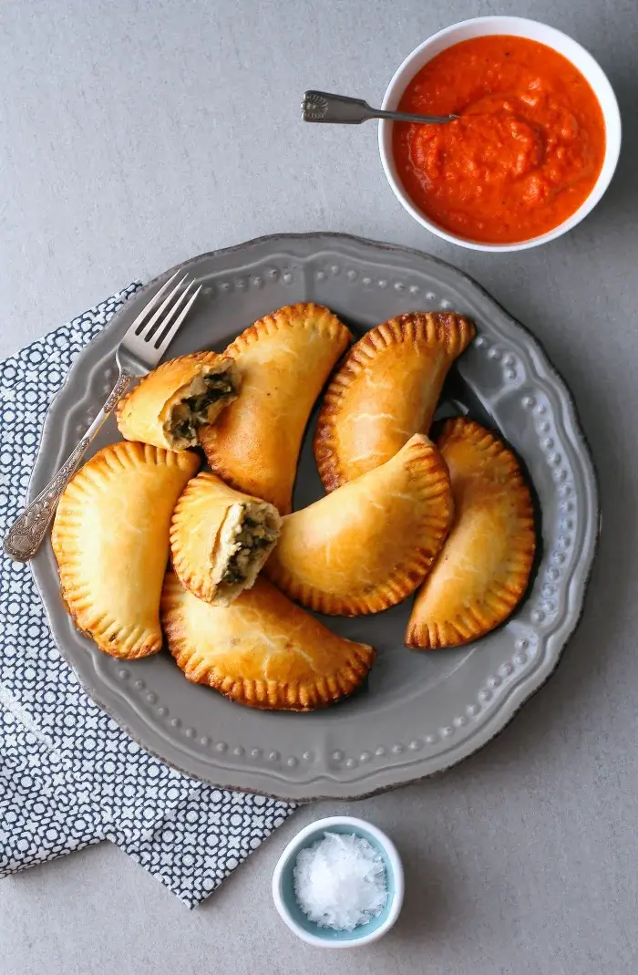 Spinach And Feta Empanadas With Red Pepper Sauce