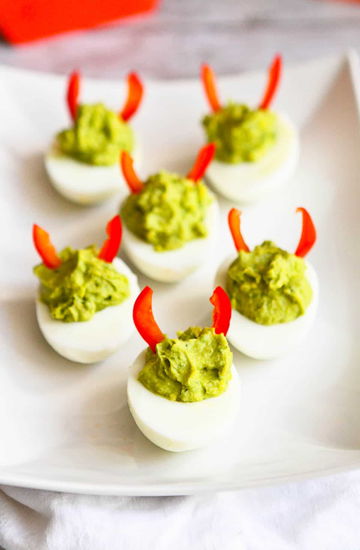 Devilish Avocado Sriracha Deviled Eggs