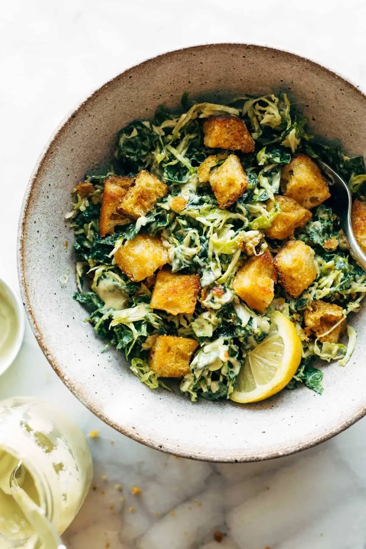 Brussels & Kale Caesar with Cheezy Garlic Croutons