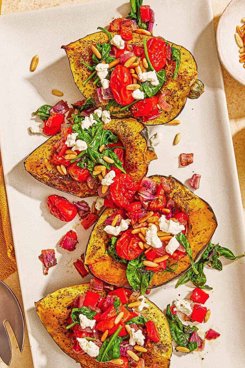 Stuffed Acorn Squash with Tomatoes, Spinach, and Goat Cheese